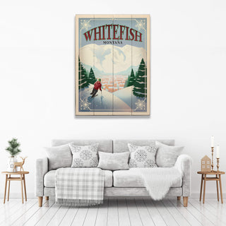 Poster of a winter scene with a skier in Whitefish, Montana above a gray sofa.