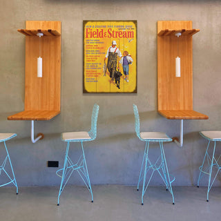 Field & Stream Cover February 1969 - Wood & Metal Wall Art displayed above modern blue metal stools and wood wall-mounted tables.
