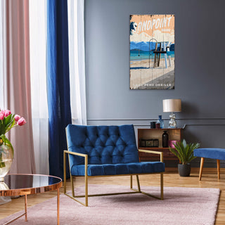 Modern living room with a blue sofa, coffee table, and decorative wall art.