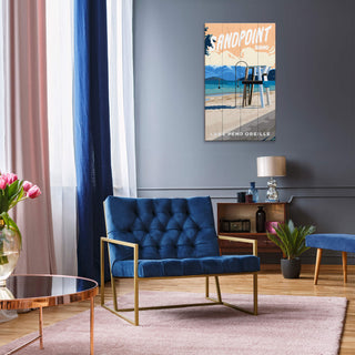 Modern living room with a blue sofa, coffee table, and decorative wall art.